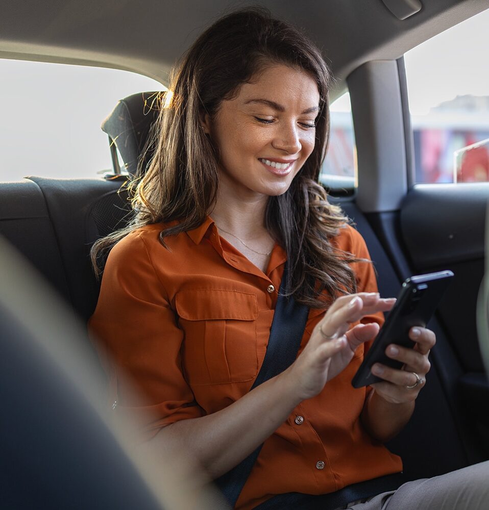lady-sitting-in-car-using-phone